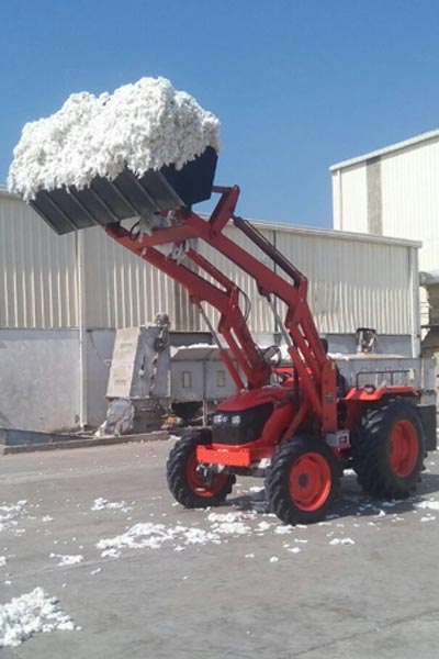 Tractor mounted front end loaders