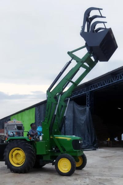 Tractor mounted front end loaders